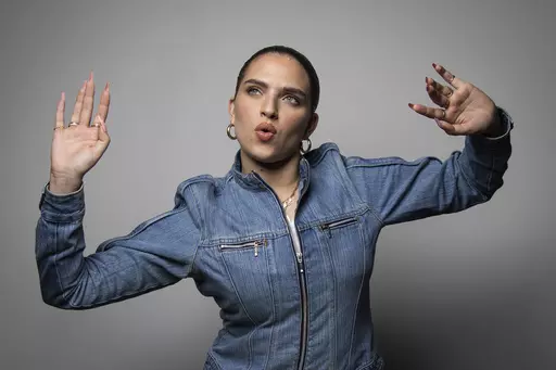 Mae Muller, representing the United Kingdom in the Eurovision Song Contest poses for a photographer, in London Tuesday, March 14, 2023. (Photo by Vianney Le Caer/Invision/AP)