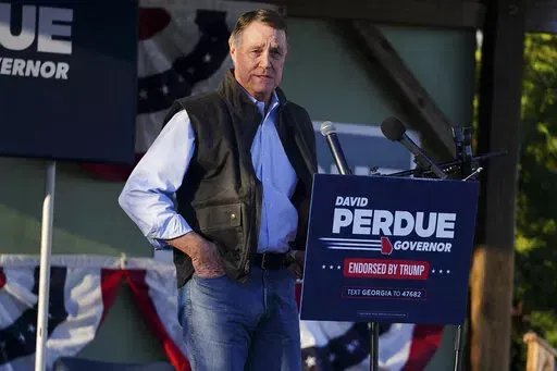 Republican candidate for Georgia Governor formerSen. David Perdue speaks at a rally to oppose a proposed Rivian electric vehicle assembly plant on March 1, 2022, in Rutledge, Ga. During his two Senate campaigns, Republican David Perdue raked in millions in campaign cash. But as he tries to unseat Georgia's incumbent governor, fellow Republican Brian Kemp, Perdue is struggling to attract big bucks.(AP Photo/John Bazemore, File)