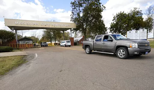 Traffic leaves the front gate to the Mississippi State Penitentiary in Parchman, Miss., Nov. 17, 2021. In January 2023, lawsuits that challenged shoddy living conditions at the prison were dismissed after attorneys said improvements have been made there since 2020. The changes include installation of air conditioning in most of the prison and updates to the electrical, water and sewer systems. (AP Photo/Rogelio V. Solis, File)