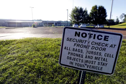 A security notice is posted outside the Hinds County Detention Center in Raymond, Miss., on June 12, 2015. A federal judge has issued a civil contempt order over conditions at the detention center.  U.S. District Judge Carlton Reeves wrote Friday, Feb. 4, 2022, that Hinds County officials have failed to fix problems in the jail that has experienced violence and lax security.  (AP Photo/Rogelio V. Solis, File)