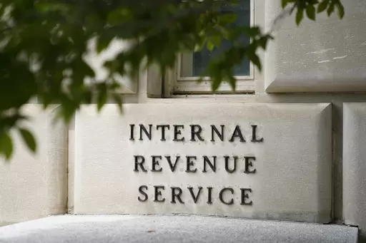 A sign outside the Internal Revenue Service building in Washington, on May 4, 2021. Effective immediately, the Internal Revenue Service will end its decades-old policy of making unannounced home and business visits — in a nod to worker safety and combatting scammers who pose as IRS agents. (AP Photo/Patrick Semansky, File)