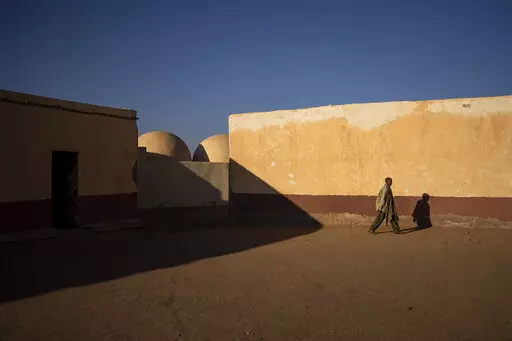 A Sahrawi man walks on the patio of a closed school in Bir Lahlou, Western Sahara, Wednesday, Oct. 13, 2021.  Morocco’s royal palace says that Spain’s prime minister has told the Moroccan king that a proposal for establishing an autonomous Western Sahara under Rabat’s rule is “the most serious, realistic and credible” initiative for resolving a decades-long dispute over the vast territory. The palace says Friday, March 18, 2021 that, in a letter to King Mohammed VI, Prime Minister Pedr
