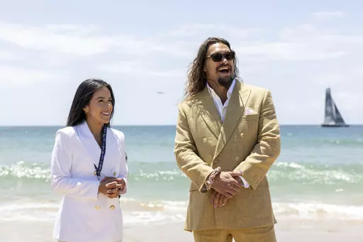 In this image provided by the the United Nations Youth and Innovation Forum, Daniela Fernandez, left, founder and CEO of Sustainable Ocean Alliance, and actor and ocean activist Jason Momoa smile during a ceremony at the UN Ocean Conference where Momoa was made a United Nations advocate for Life Below Water in June, 2022, in Cascais, Portugal. Fernandez has no trouble attracting volunteers to her group Sustainable Ocean Alliance. Last month, she presided over the Our Ocean Youth Leadership Summi