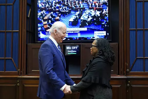 President Joe Biden and Supreme Court nominee Judge Ketanji Brown Jackson watch as the senate votes on her confirmation from the Roosevelt Room of the White House in Washington, April 7, 2022. (AP Photo/Susan Walsh, File)