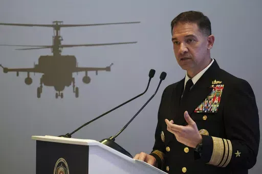 U.S. Navy Vice Adm. Brad Cooper, who heads the Navy's Bahrain-based 5th Fleet, speaks at an event at the International Defense Exhibition and Conference in Abu Dhabi, United Arab Emirates, Feb. 21, 2023. Iran is "very directly involved" in attacks by Yemen's Houthi rebels on shipping over Israel's war on Hamas in the Gaza Strip, Cooper told The Associated Press on Monday, Jan. 22, 2024. (AP Photo/Jon Gambrell, File)