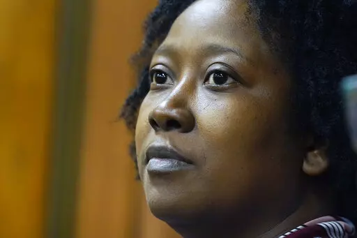 Tanya Marsaw, a parent of four with one child in a public middle school, and a member of Parents For Public Schools, listens as attorneys for the nonprofit group present arguments in Hinds County Chancery Court, in Jackson, Miss., Tuesday, Aug. 23, 2022, in a lawsuit claiming the state is violating its own constitution with a federally funded grant program for private schools. (AP Photo/Rogelio V. Solis)