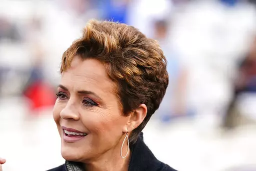 Arizona Republican gubernatorial candidate Kari Lake attends a rally in Florence, Ariz., on Jan. 15, 2022. Lake condemned the growing cultural clout of drag queens, jumping into the latest social grievance taking hold on the right. Her comments were quickly condemned by Richard Stevens, one of the most popular drag performers in Phoenix, who says Lake regularly attended drag shows and had photos on his social media accounts of Lake posing with drag queens and screenshots of his conversations wit