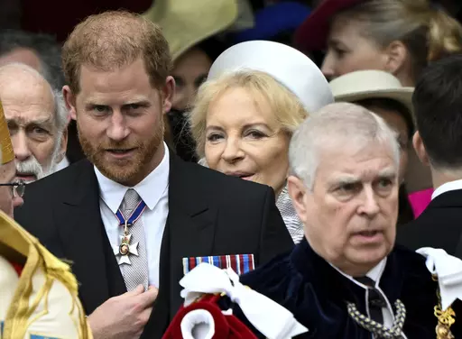 Britain's Prince Harry, Duke of Sussex, and Prince Andrew leave Westminster Abbey following the coronation ceremony of Britain's King Charles and Queen Camilla, in London, Saturday, May 6, 2023. (Toby Melville, Pool via AP)