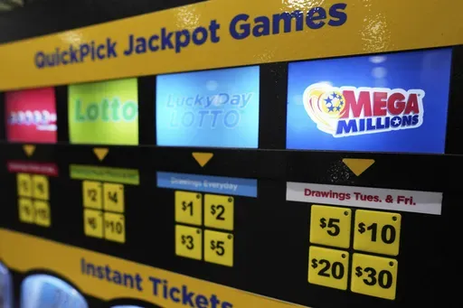 A lottery ticket vending machine is seen at a convenience store in Chicago, Sunday, April 6, 2025. (AP Photo/Nam Y. Huh)