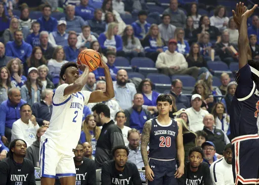 Kentucky's Jaxson Robinson (2) prepares to shoot a 3-point basket while guarded by Jackson State's Dorian McMillian, right, during the first half of an NCAA college basketball game in Lexington, Ky., Friday, Nov. 22, 2024. (AP Photo/James Crisp)
