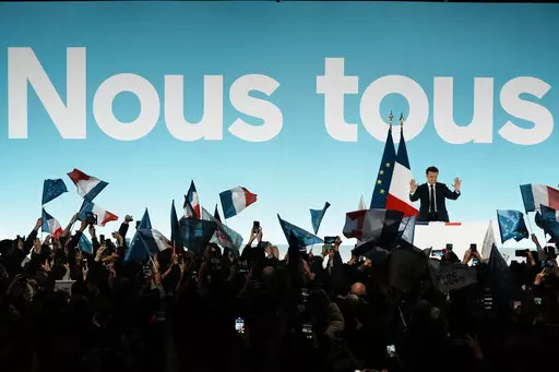 Current French President and centrist presidential candidate for reelection Emmanuel Macron arrives to delivers his speech at his election night headquarters Sunday, April 10, 2022 in Paris. French polling agencies projected Sunday that incumbent Emmanuel Macron and far-right nationalist Marine Le Pen are heading for another winner-takes-all runoff in the French presidential election, with their fierce political rivalry and sharply opposing visions pulling clear of a crowded field of 12 candidat