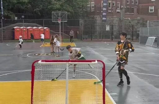 Kids play ball hockey at an NHL Street event in Boston, Mass., on Saturday, June 17, 2023. The league launched a street hockey program earlier this year aimed at getting more people interested in the sport. (AP Photo/Jimmy Golen)