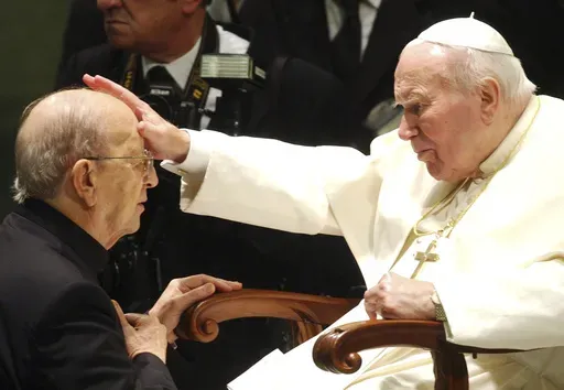 Pope John Paul II gives his blessing to late father Marcial Maciel, founder of Christ's Legionaries, during a special audience the pontiff granted to about four thousand participants of the Regnum Christi movement, at the Vatican, on Nov. 30, 2004. The recently-opened archives of Pope Pius XII have shed new light on claims the World War II-era pope didn't speak out about the Holocaust. But they're also providing details about another contentious chapter in Vatican history: the scandal over the f