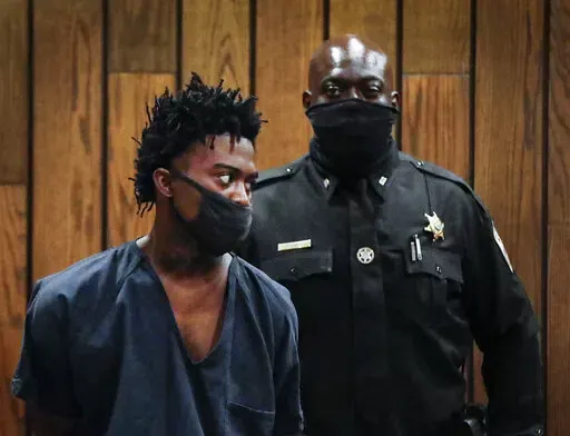 Ezekeil Kelly, left makes his first court appearance on Friday, Sept. 9, 2022 in Memphis, Tenn. Kelly is  accused of killing four people and wounding three others in a livestreamed shooting rampage that paralyzed Memphis and led to a city-wide manhunt.  (Mark Weber/Daily Memphian via AP)