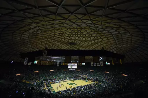 A crowd watches the first half of an NCAA college basketball game between Baylor and Mississippi Valley State, Friday, Dec. 22, 2023, in Waco, Texas. The game marks the final basketball matchup at the venue as the Baylor basketball team is scheduled to begin playing at Foster Pavilion. (AP Photo/Julio Cortez)