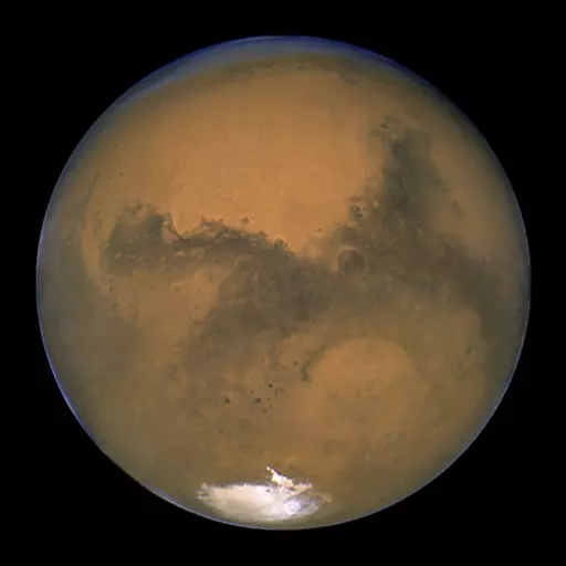 This Aug. 26, 2003, image made available by NASA shows Mars as it lines up with the Sun and the Earth. A new study suggests water on Mars may be more widespread and recent than previously thought. Scientists reported the finding from China's Mars rover in Science Advances on Friday, April 28, 2023. (NASA/J. Bell - Cornell U./M. Wolff - SSI via AP, File)