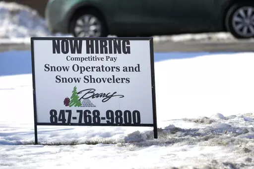 A hiring sign is displayed in Arlington Heights, Ill., Sunday, Feb. 5, 2022. On Thursday, the Labor Department reports on the number of people who applied for unemployment benefits last week. (AP Photo/Nam Y. Huh)
