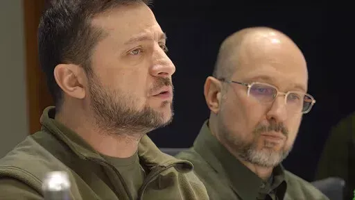 In this image from video provided by the Ukrainian Presidential Press Office, Ukrainian President Volodymyr Zelenskyy speaks during a meeting with Slovenia Prime Minister Janez Jansa, Czech Republic Prime Minister Petr Fiala, Polish Prime Minister Mateusz Morawiecki and Polish Deputy Prime Minister Jaroslaw Kaczynski on behalf of the European Council, in Kyiv, Ukraine, on Tuesday, March 15, 2022. (Ukrainian Presidential Press Office via AP)