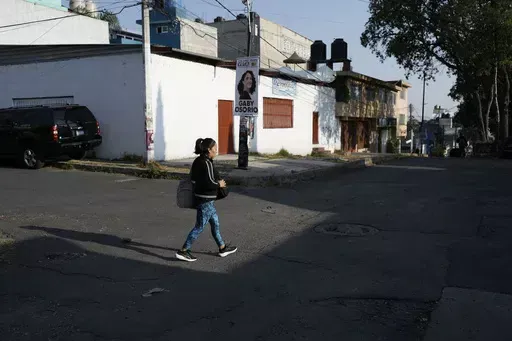 Domestic worker Concepcion Alejo heads to her workplace, in Mexico City, Wednesday, April 24, 2024. Alejo is among approximately 2.5 million Mexicans — largely women — who serve as domestic workers in the Latin American nation. (AP Photo/Marco Ugarte)