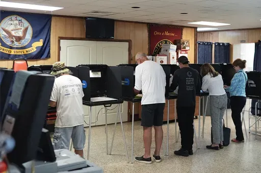 Voters fill in their ballots for Florida's primary election in South Miami, Fla., Aug. 20, 2024. (AP Photo/Rebecca Blackwell, File)