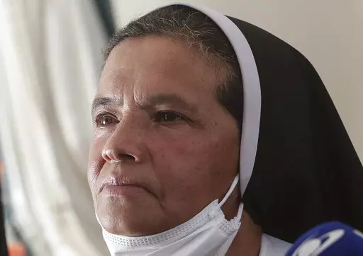 FILE — Colombian nun Gloria Cecilia Narvaez, who was held captive for nearly five years by al-Qaida-linked militants, listens to a question during a press conference in Bogota, Colombia, in this Friday, Nov. 19, 2021 file photo. Pope Francis authorized spending up to 1 million euro to free Narvaez, Cardinal Angelo Becciu testified at the Vatican's big financial fraud trial Thursday, May 5, 2022, revealing previously top secret negotiations that Francis authorized to hire a British security and