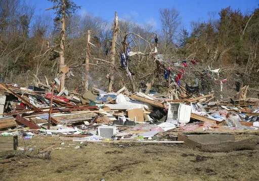 Cleanup efforts are underway in Winterset, Iowa, on Sunday, March 6, 2022, after a tornado tore through an area southwest of town on Saturday. (Bryon Houlgrave/The Des Moines Register via AP)