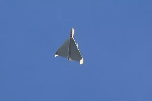 A drone is seen in the sky seconds before it fired on buildings in Kyiv, Ukraine, on Oct. 17, 2022. Russia launched a new barrage of missiles and drones in an overnight attack on June 22, 2024, officials in Kyiv said Saturday, damaging energy facilities in Ukraine's southeast and west and injuring at least two workers. (AP Photo/Efrem Lukatsky, File)