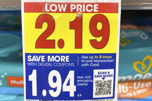 A digital-only coupon for Pampers brand baby wipes is displayed at a Kroger in Ann Arbor, Michigan, on Tuesday, Nov. 16, 2022. A coalition of consumer groups is calling on grocers to stop offering digital-only deals, saying they discriminate against people without smartphones or regular internet access.(AP Photo/Dee-Ann Durbin)