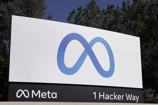 Facebook's Meta logo sign is seen at the company headquarters in Menlo Park, Calif., Oct. 28, 2021. European Union hits Facebook parent Meta with record $1.3 billion fine over transfers of user data to US. (AP Photo/Tony Avelar, File)
