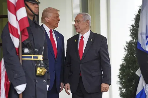 President Donald Trump, left, greets Israel's Prime Minister Benjamin Netanyahu at the White House, Monday, April 7, 2025, in Washington. (AP Photo/Evan Vucci)