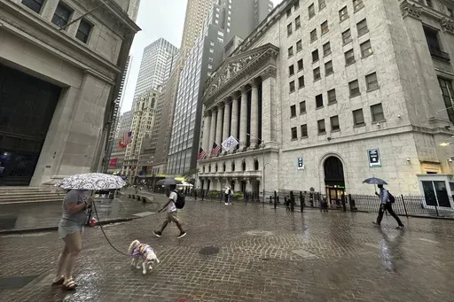 People walk past the New York Stock Exchange on Aug. 7, 2024 in New York. (AP Photo/Peter Morgan, File)