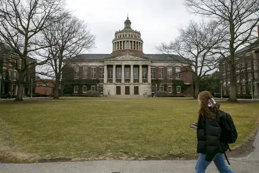 A student walks by the Rush Rhees Library at the University of Rochester, Feb. 22, 2023. (AP Photo/Ted Shaffrey, File)