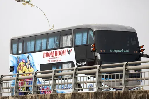 A bus, believed to be carrying Chinese nationals who have worked at scam centers in eastern Myanmar, crosses the 2nd Thai-Myanmar Friendship Bridge in Mae Sot in Thailand's Tak province before being flown back to China on Thursday, Feb. 20, 2025. (AP Photo/Sarot Meksophawannakul)