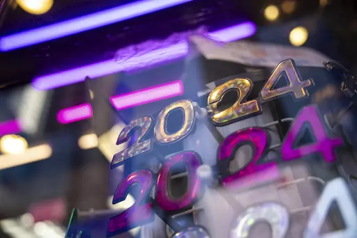 2024 glasses are displayed ahead of New Year's Eve in Times Square, Friday, Dec. 29, 2023, in New York. (AP Photo/Yuki Iwamura)