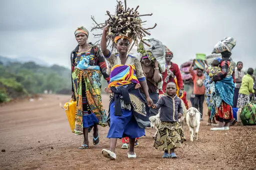 Residents flee fighting between M23 rebels and Congolese forces near Kibumba, some 20 kms ( 12 miles) North of Goma, Democratic republic of Congo, on Oct. 29, 2022. The accounts are haunting. Abductions, torture, rapes. Scores of civilians including women and children have been killed by the M23 rebels in eastern Congo, according to a U.N. report expected to be published this week. (AP Photo/Moses Sawasawa, File)