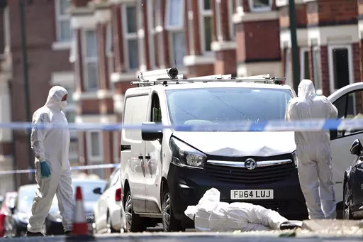 Police forensics officers search a white van on the corner of Maples Street and Bentinck Road in Nottingham, as three people have been found dead in the city in what police described as a "horrific and tragic incident". A 31-year-old man has been arrested on suspicion of murder after two people were found dead in the street in Ilkeston Road just after 4am on Tuesday. A third man was found dead in Magdala Road, Nottinghamshire Police said. Another three people are in hospital after someone tried 