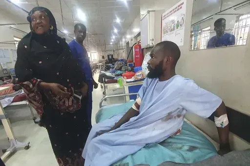 An injured victim of a suicide bomb attack receives treatment at a hospital in Maiduguri, Nigeria, on June 30, 2024. Recent suicide bombings in northeastern Nigeria have raised questions about the country's claim that it has degraded the Islamic extremists whose insurgency since 2009 has killed more than 35,000 people directly and displaced more than 2 million. (AP Photo/Joshua Omiri, File)