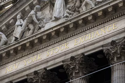 The New York Stock Exchange signage glistens in the noon sun on October 4, 2023, in New York. (AP Photo/J. David Ake, File)
