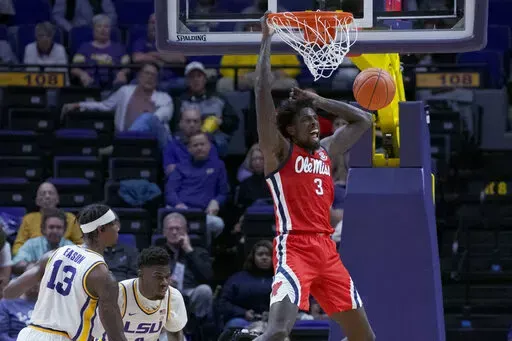Mississippi center Nysier Brooks (3) dunks against LSU during the first half of an NCAA college basketball game in Baton Rouge, La., Tuesday, Feb. 1, 2022. (AP Photo/Matthew Hinton)