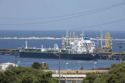 The San Sebastian oil tanker is moored at the docks of the ISAB refinery in Priolo-Gargallo near Syracuse, Sicily, May 31, 2022. The ISAB is owned by Russia's Lukoil. The U.S. and its allies are navigating questions as they plan to impose a price cap on Russian oil by December. (AP Photo/Gaetano Adriano Pulvirenti, File)