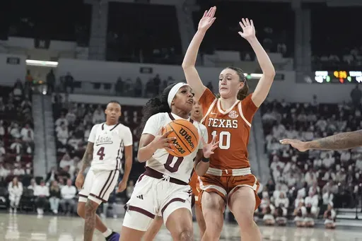 Mississippi State guard Denim DeShields (0) is guarded by Texas guard Shay Holle (10) during the second half of an NCAA college basketball game, Thursday, Feb. 27, 2025, in Starkville, Miss. (AP Photo/Rogelio V. Solis)