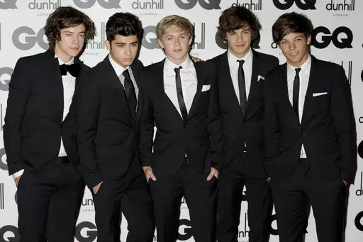 One Direction's Liam Payne, second from right, poses for a photo with fellow band members Harry Styles, Zayn Malik, Niall Horan and Louis Tomlinson at the GQ Men of the Year Awards in London, Sept. 6, 2011. (AP Photo/Jonathan Short, File)