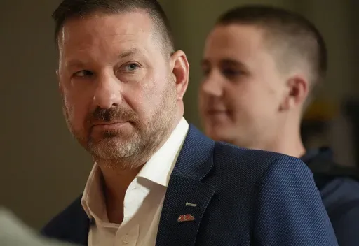 Ole Miss head coach Chris Beard moves between interviews during the Southeastern Conference NCAA college basketball Media Day in Birmingham, Ala., Tuesday, Oct. 15, 2024. (AP Photo/Gary Cosby Jr., Tuscaloosa News)