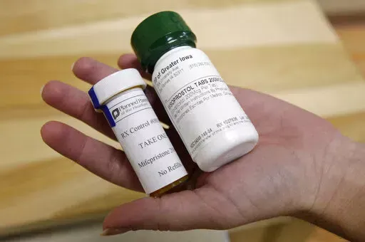 This Sept. 22, 2010 file photo shows bottles of abortion pills at a clinic in Des Moines, Iowa. The Food and Drug Administration on Thursday, Dec. 16, 2021 loosened some restrictions on the pill mifepristone, allowing it to be dispensed by more pharmacies. (AP Photo/Charlie Neibergall, file)