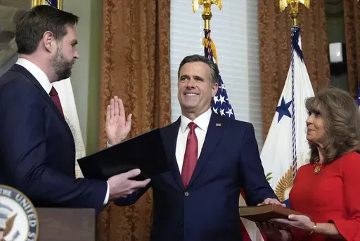 Vice President JD Vance swears in John Ratcliffe as CIA Director as his wife Michele holds the Bible in the Vice Presidential ceremonial office in the Eisenhower Executive Office Building on the White House campus, Thursday, Jan. 23, 2025, in Washington. (AP Photo/Alex Brandon)