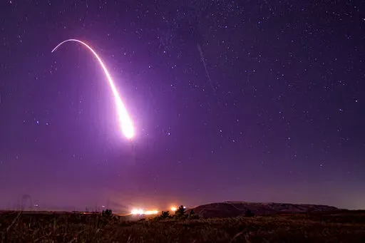 FILE - This image taken with a slow shutter speed on Oct. 2, 2019, and provided by the U.S. Air Force shows an unarmed Minuteman 3 intercontinental ballistic missile test launch at Vandenberg Air Force Base, Calif. Major shifts in U.S. nuclear weapons policy seem much less likely, and while President Joe Biden may insist on certain adjustments, momentum toward a historic departure from the Trump administration's policy appears to have stalled. The outlook will be clearer when the Biden administr