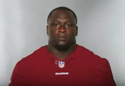 Jerrell Powe, of the Washington Redskins, poses for a photo in June 2016. Powe, a former University of Mississippi and NFL football player has been arrested in Mississippi on kidnapping charges. He remained jailed Monday, Jan. 16, 2023, in the Jackson, Miss., suburb of Ridgeland, Miss., with no bail set. It is unclear if he has a lawyer to speak for him. (AP Photo, File)