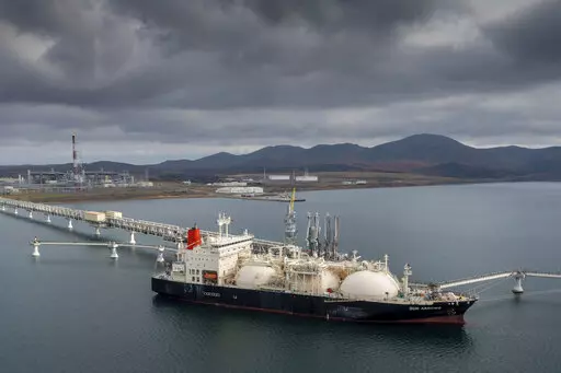 The tanker Sun Arrows loads its cargo of liquefied natural gas from the Sakhalin-2 project in the port of Prigorodnoye, Russia, on Oct. 29, 2021. The United States unleashed some of its toughest actions against Russian President Vladimir Putin right after he rolled his troops into Ukraine. Polls show people want the U.S. to do more. (AP Photo/File)