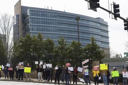 Demonstrators protest Centers for Disease Control and Prevention (CDC) layoffs in front of the CDC headquarters in Atlanta, Feb. 18, 2025. (Arvin Temkar/Atlanta Journal-Constitution via AP, file)