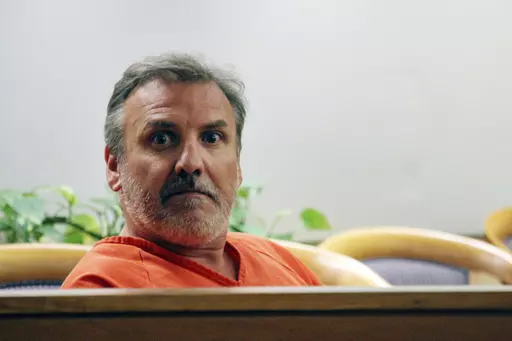 Brian Steven Smith sits in a courtroom while waiting for his arraignment to start in Anchorage, Alaska, Oct. 16, 2019. The double murder trial of Smith, a South Africa native accused of killing two Alaska Native women will begin this week, more than four years after a woman provided police with a digital memory card that authorities said contained images and video of one of the killings. (AP Photo/Mark Thiessen, File)